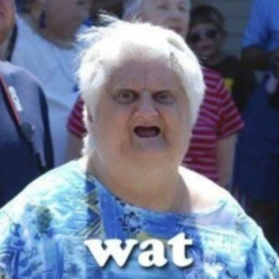 Image of an old overweight woman with open mouth, looking very confused, caption “Wat”